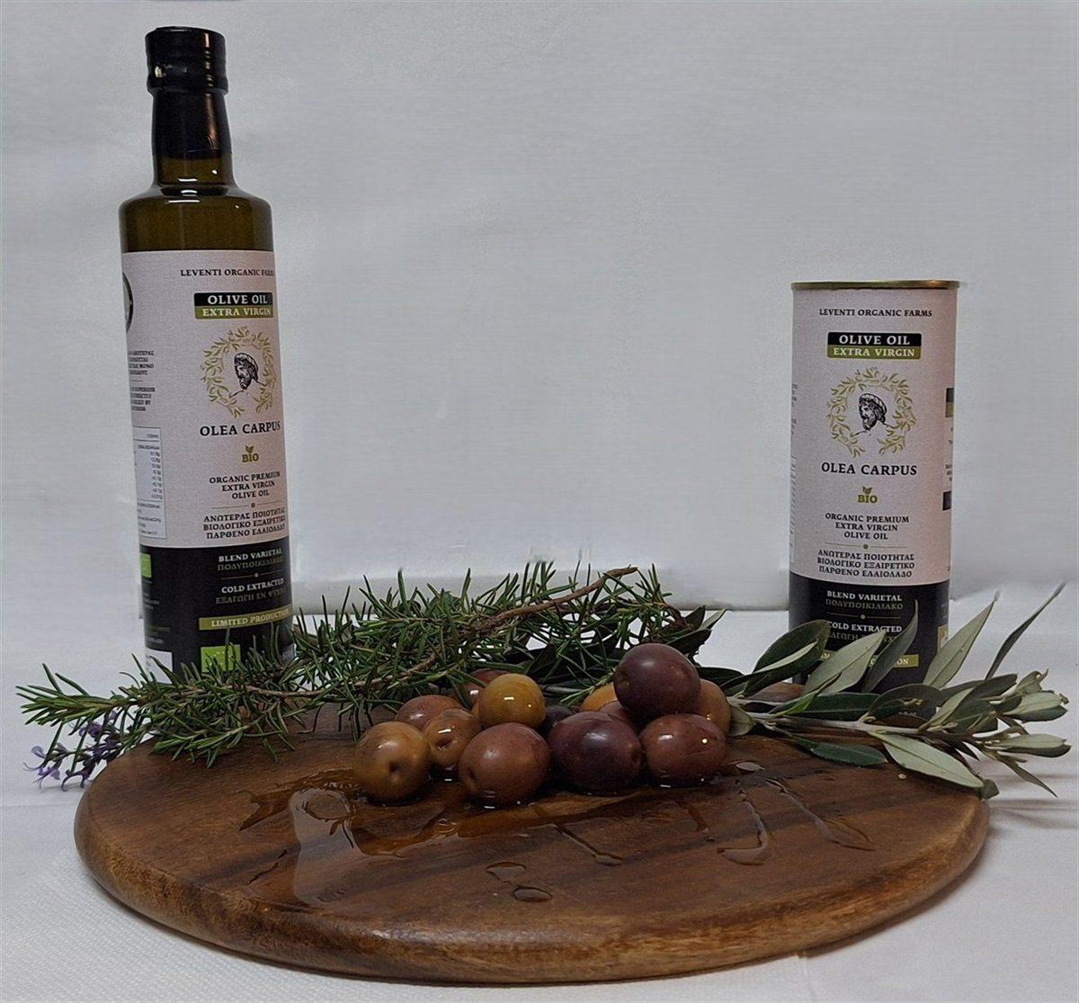 Bottle and 500ml metal container of Olea Carpus on a wooden surface with olives